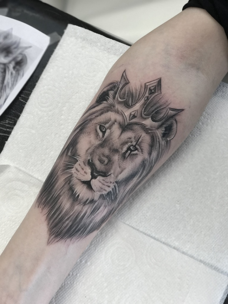 Lion with Crown Forearm Tattoo by Esther – Black & Grey | Unicorn Tattoo Art Collective, Ashford Surrey