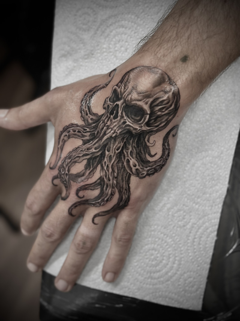 Black and Grey Octopus Hand Tattoo by Esther | Unicorn Tattoo Ashford Surrey