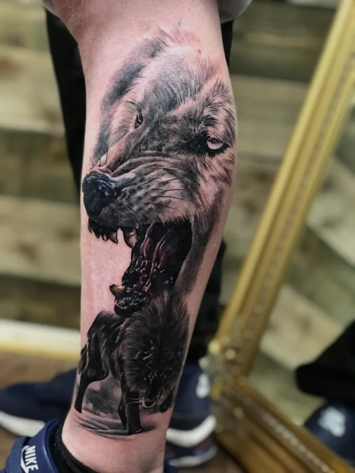Photorealistic black and grey snarling wolf calf tattoo by Esther, Unicorn Tattoo Art Collective, Ashford Surrey