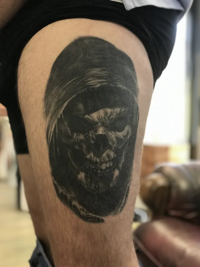 Healed black and grey grim reaper skull thigh tattoo by Esther, Unicorn Tattoo Art Collective, Ashford Surrey