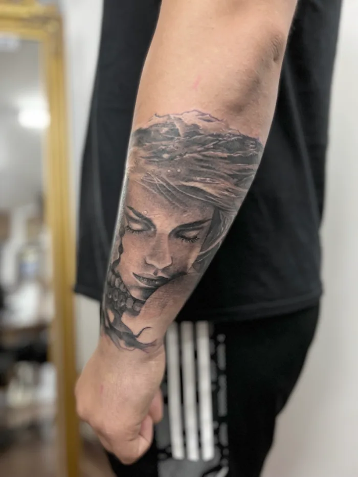 Black and grey portrait forearm sleeve tattoo by Esther, Unicorn Tattoo Art Collective, Ashford Surrey
