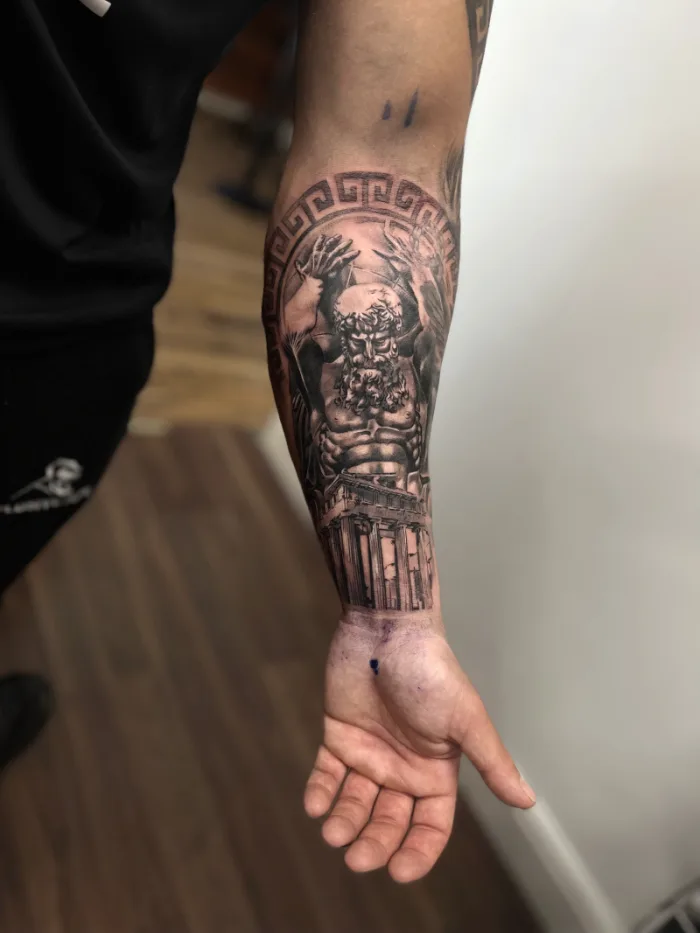 Black and grey Greek Titan Atlas with Parthenon temple forearm sleeve tattoo by Esther, Unicorn Tattoo Art Collective, Ashford Surrey