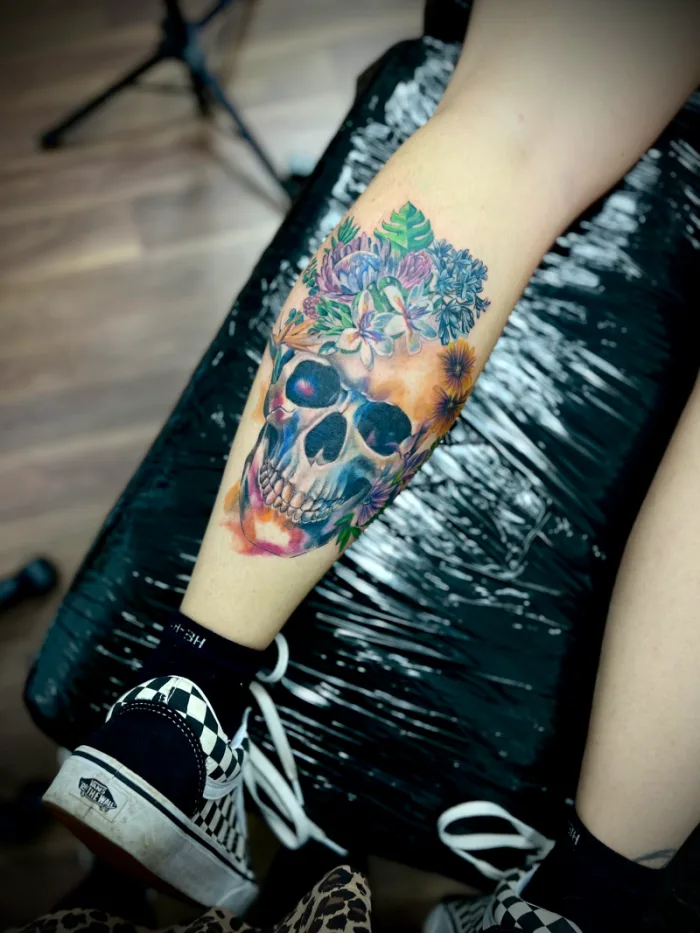 Colour floral skull calf tattoo with watercolour effect by Esther, Unicorn Tattoo Art Collective, Ashford Surrey