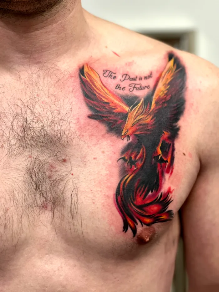 Custom colour phoenix chest tattoo with quote lettering by Esther, Unicorn Tattoo Art Collective, Ashford Surrey