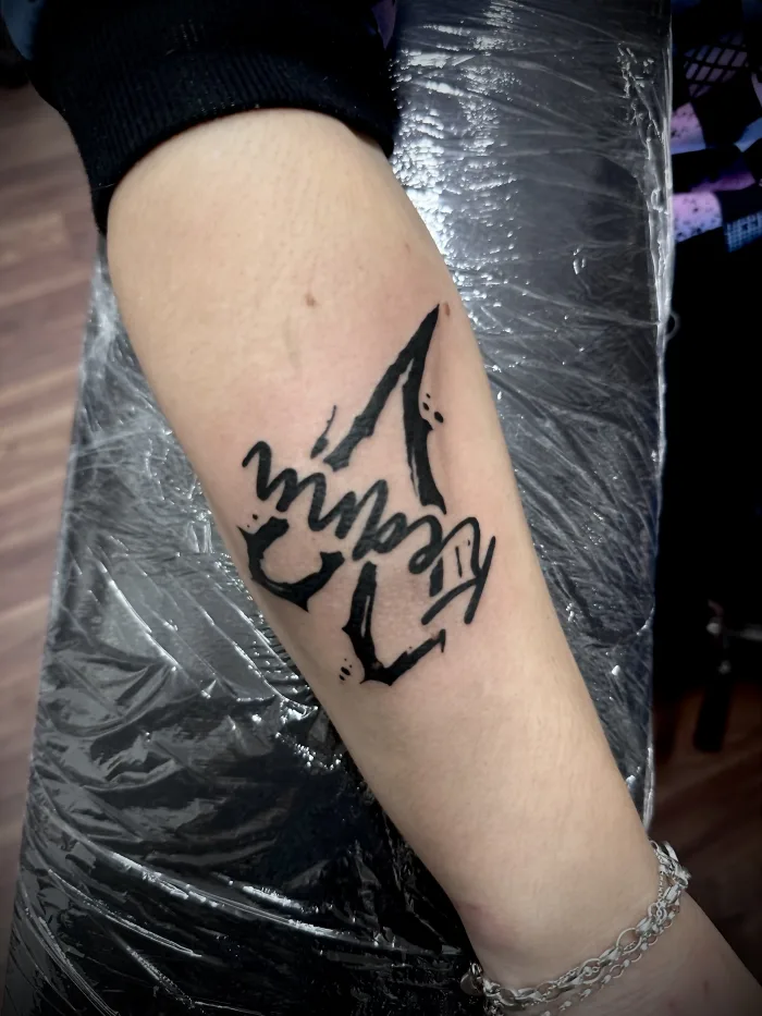Blackwork script tattoo with custom lettering, done in Ashford Surrey at Unicorn Tattoo Art Collective.