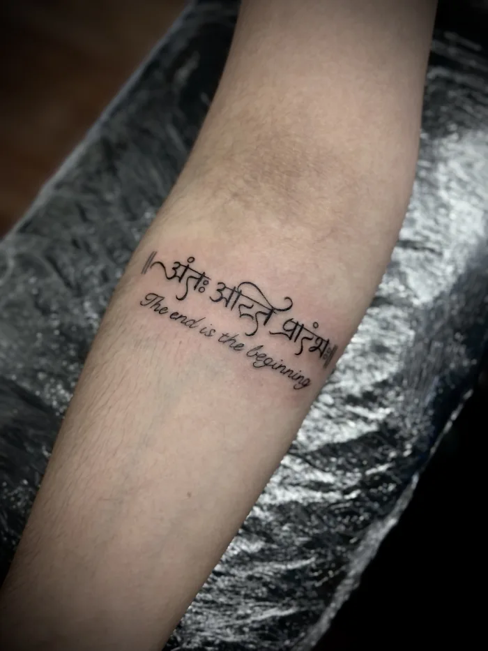 Fine line script tattoo with custom lettering on the forearm, done by Esther at Unicorn Tattoo Art Collective in Ashford, Surrey.