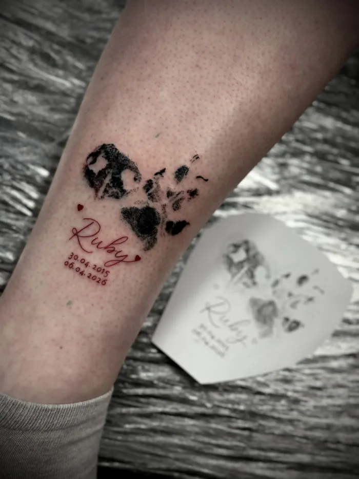 Memorial paw print tattoo with script lettering by Esther in Ashford Surrey