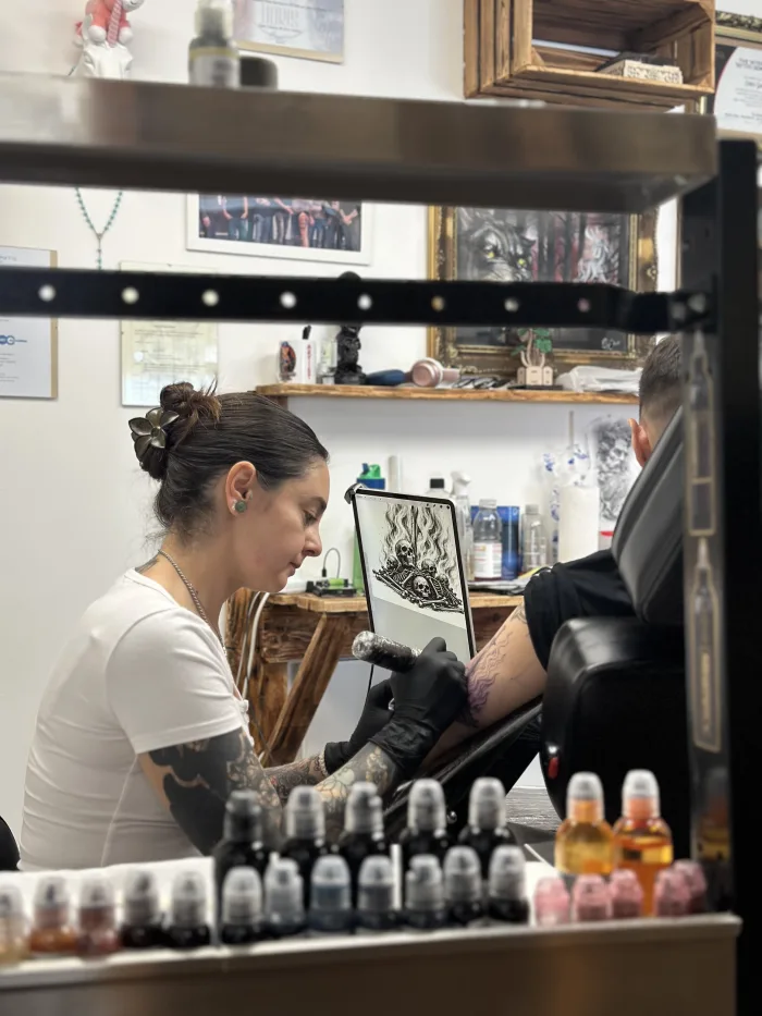 Esther working on a custom tattoo design at Unicorn Tattoo Art Collective in Ashford, Surrey