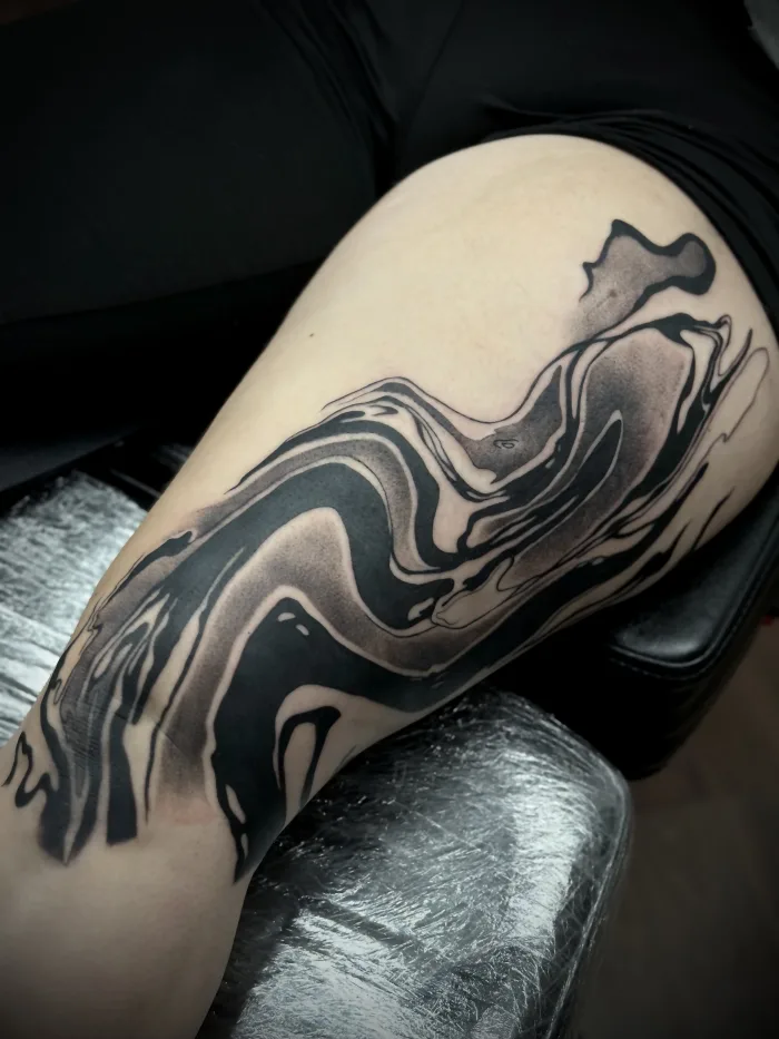 Ongoing abstract blackwork leg tattoo by Esther at Unicorn Tattoo Art Collective in Ashford, Surrey