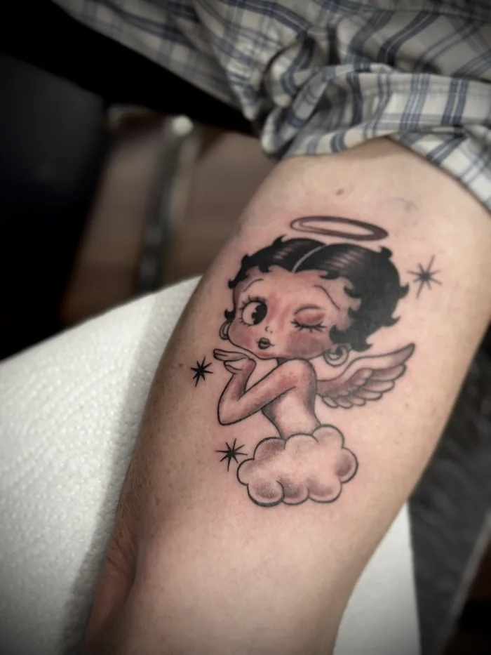 Betty Boop memorial angel tattoo by Esther at Unicorn Tattoo Art Collective in Ashford, Surrey