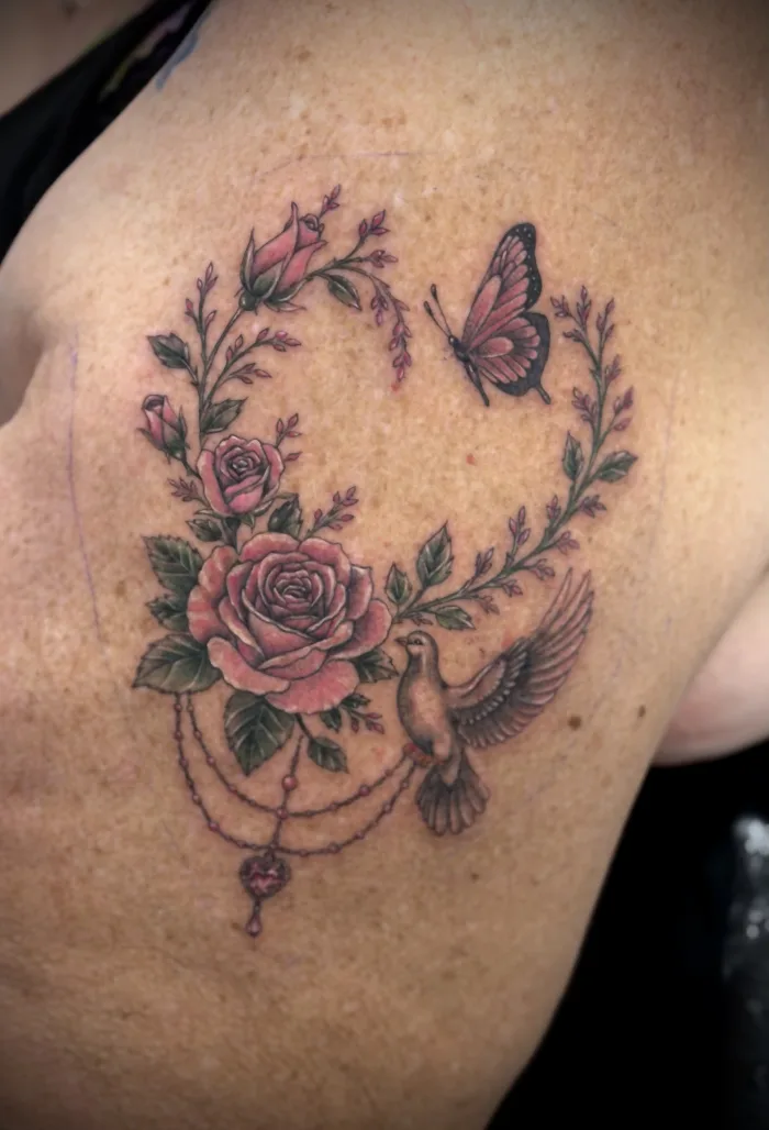 Floral colour tattoo with roses, butterfly and dove by Esther in Ashford, Surrey