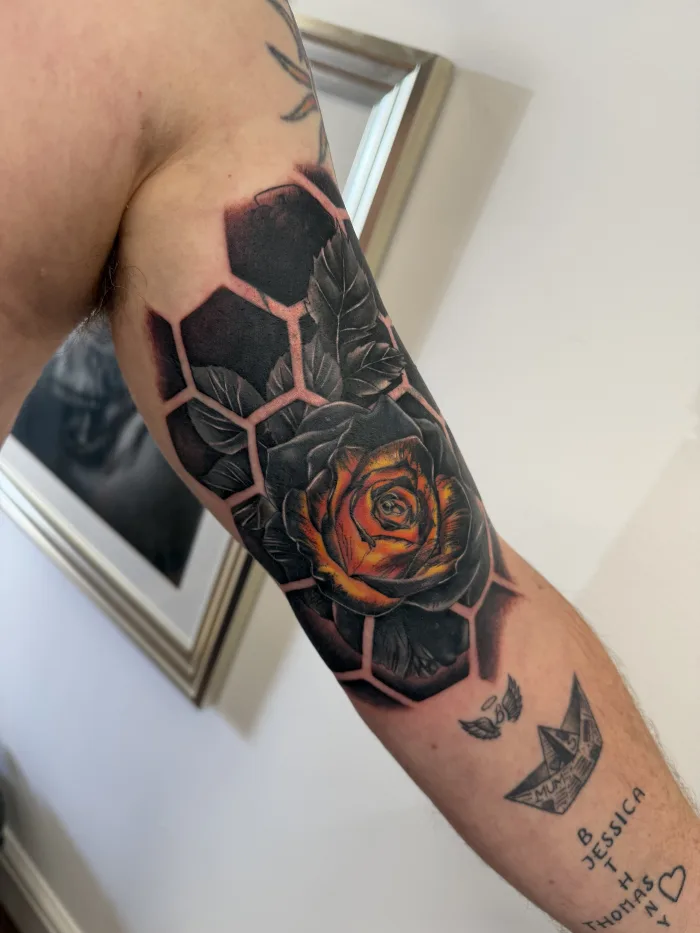 Completed colour rose cover-up tattoo with black geometric background by Esther in Ashford, Surrey